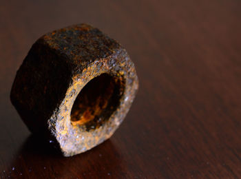 Close-up of rusty metal on table