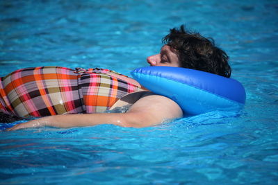 Woman swimming in pool