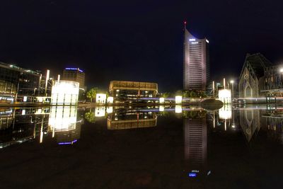 Illuminated buildings in city at night