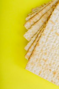 High angle view of bread in yellow background