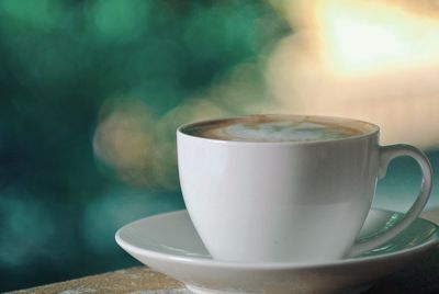 Close-up of coffee cup on table