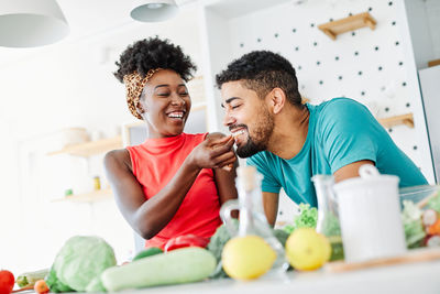 Young man and woman having food