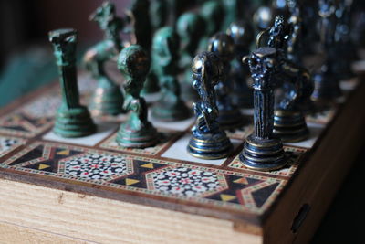 Close-up of chess pieces on table