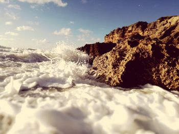 Scenic view of sea waves against sky