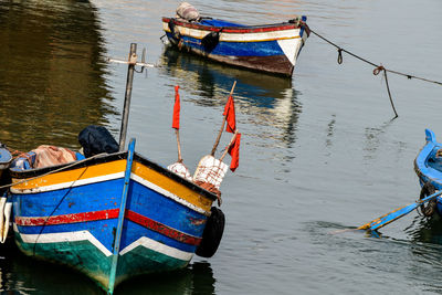 Boats moored at harbor