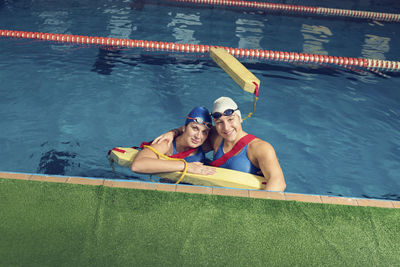 Portrait of women swimming in pool