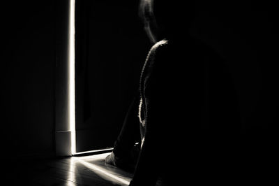 Close-up of man in dark room