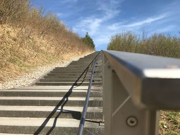 Close-up of steps against sky