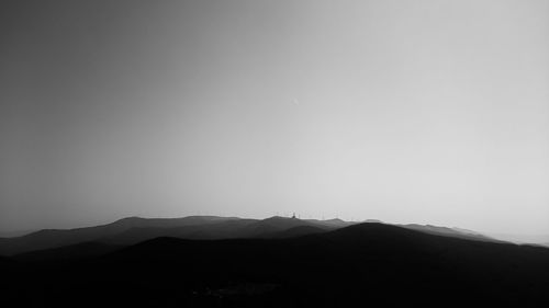 Silhouette mountain range against clear sky