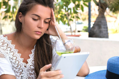 Young woman using mobile phone