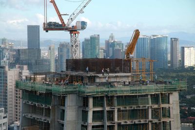 Construction site with buildings in background