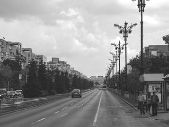 Cars on road against sky