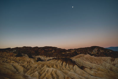 Scenic view of desert against clear sky