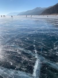 Scenic view of frozen lake against sky