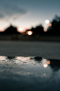 Surface level of sea against sky during sunset