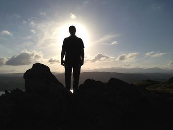 Silhouette of woman standing on landscape