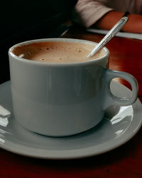 Close-up of coffee cup on table