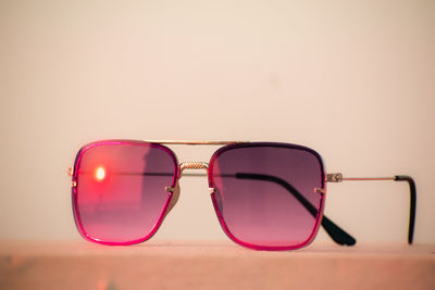 Close-up of sunglasses against white background