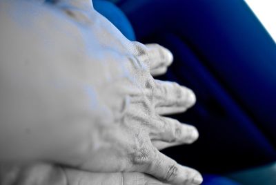 Close-up of woman hand with blue hair