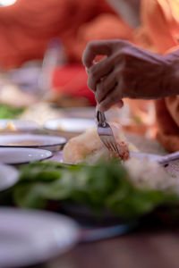 Midsection of person preparing food