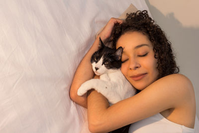 Portrait of woman with cat