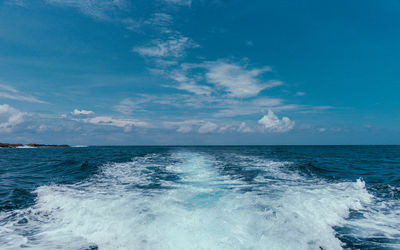 Scenic view of sea against blue sky