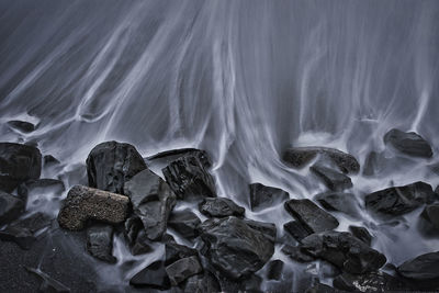 Scenic view of rocks in sea