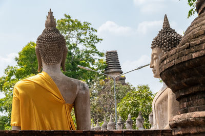 Statue of temple against building