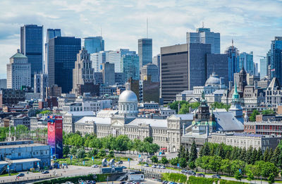 Buildings in city against sky