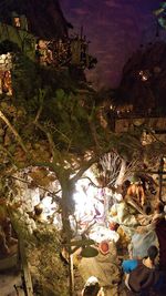 High angle view of illuminated houses at night