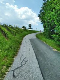 Empty road along countryside landscape