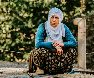 Portrait of woman sitting on seat