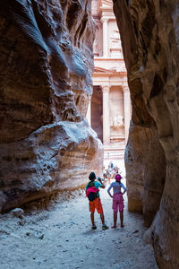 Woman standing on rock formation