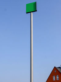 Low angle view of pole against clear blue sky