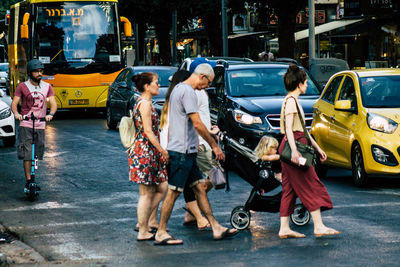 People walking on street in city