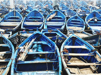 High angle view of sailboats moored at harbor