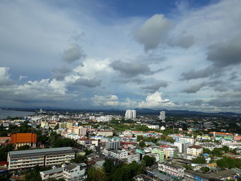 High angle view of city against cloudy sky