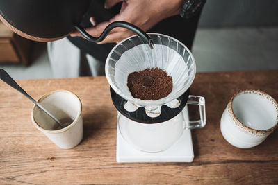 Barista dripping coffee and slow coffee bar style