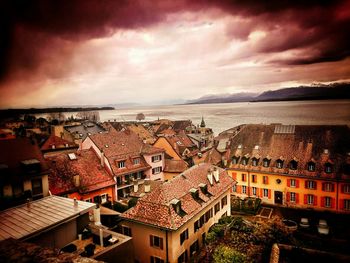 Cityscape against cloudy sky