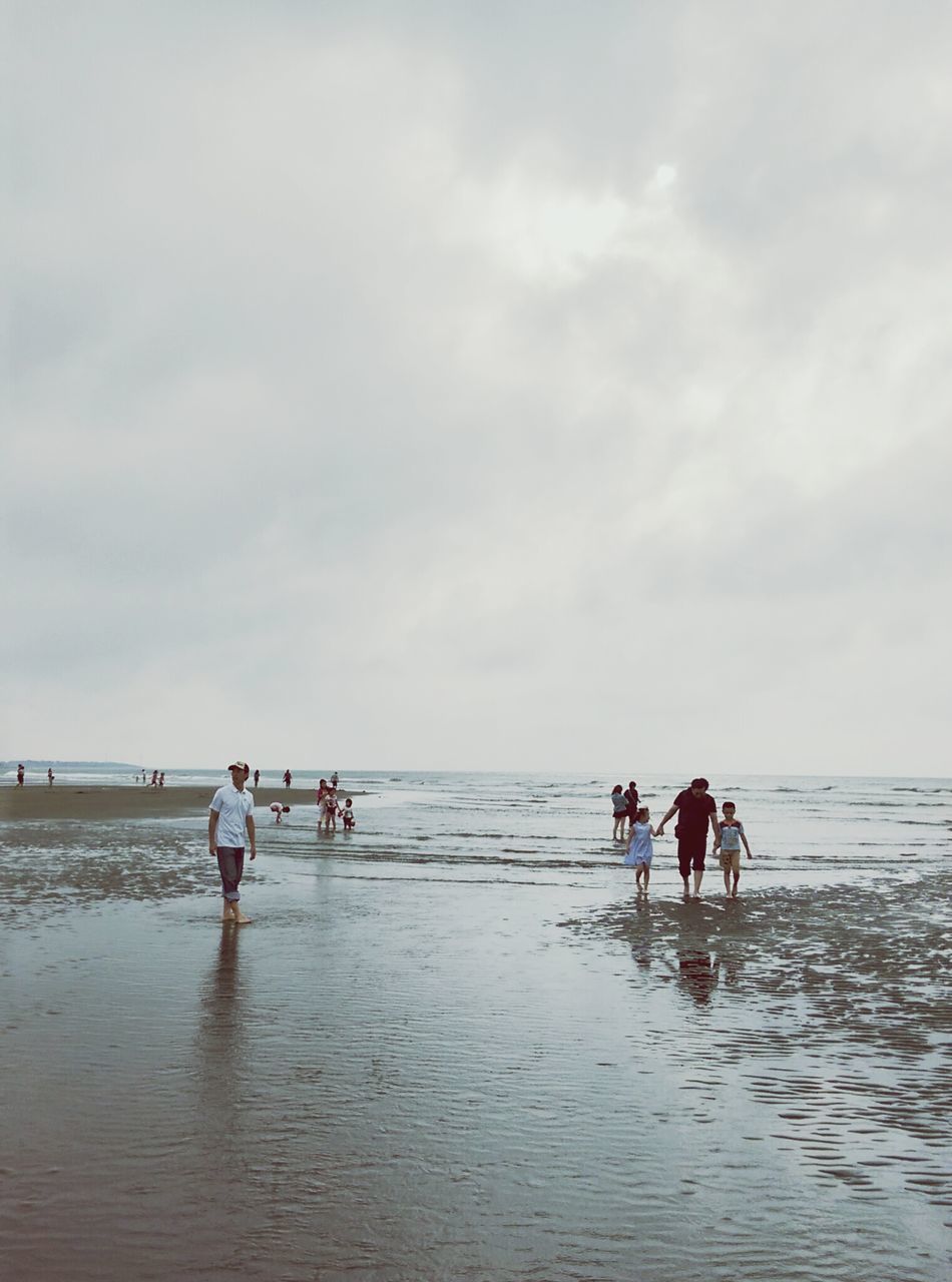 water, sea, beach, leisure activity, lifestyles, horizon over water, sky, men, togetherness, shore, vacations, person, cloud - sky, nature, full length, beauty in nature, scenics, waterfront