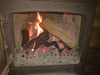 Close-up of fire burning at night