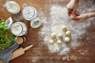 High angle view of person preparing food on table