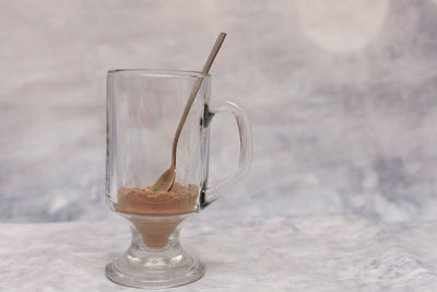 Close-up of choco powder in drink on table