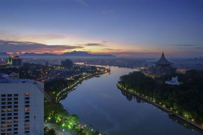 Aerial view of city buildings during sunset