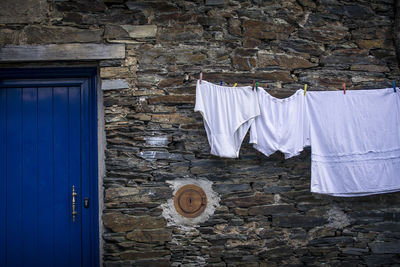Clothes drying against  wall