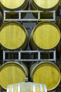 Metal silos for the fermentation of wine inside a farm. storage of wine in the cellar.