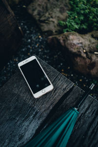 High angle view of smart phone on table