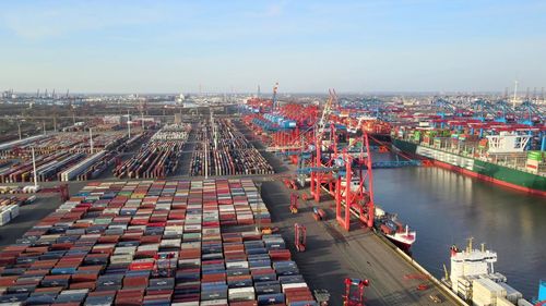 A photos of containers in a harbour