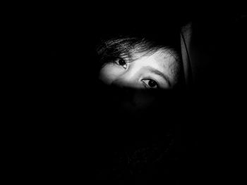Portrait of teenage girl in darkroom