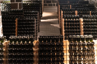 Full frame shot of wine bottles in a cave